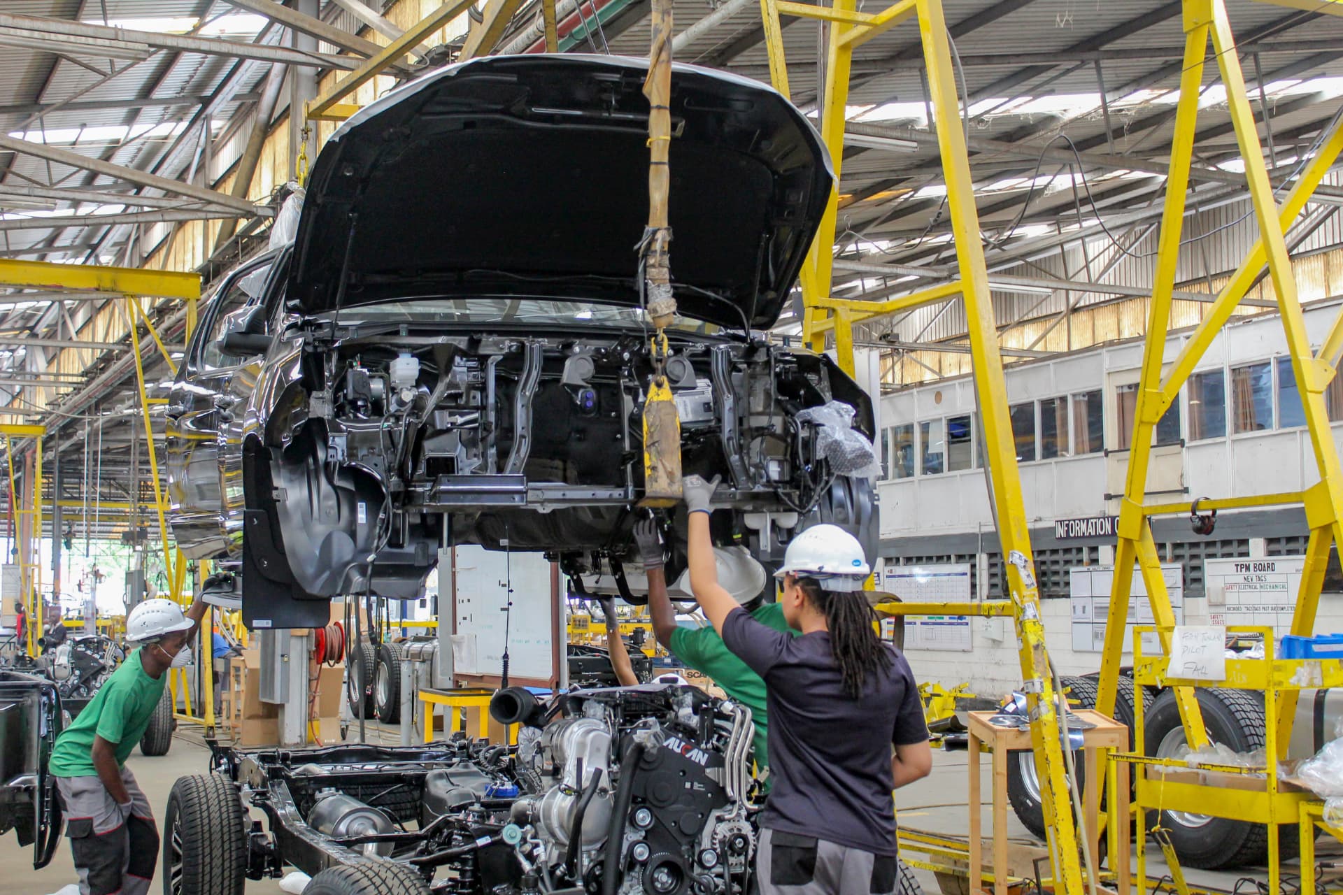 Technicians working on the vehicle assembly line at AVA Mombasa
