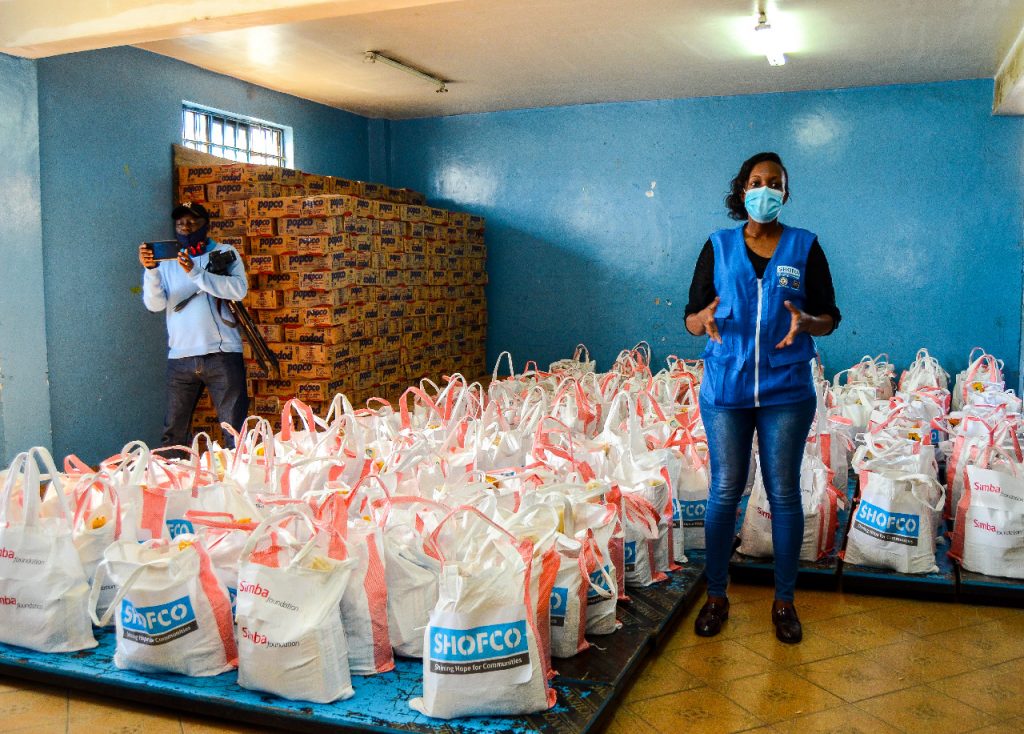 A Simba Foundation coordinator among food parcels ready for distribution